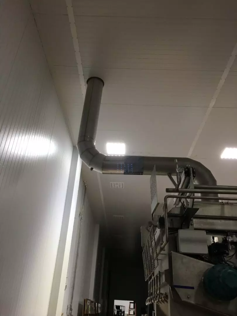 A pipe that is attached to the ceiling of a building.